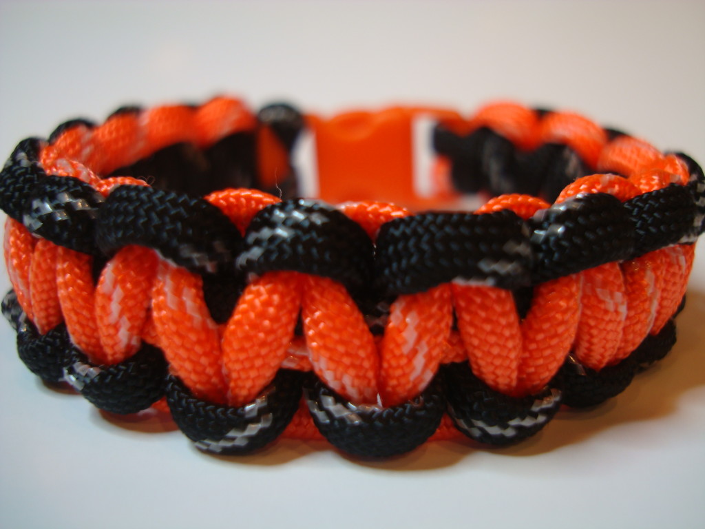 Black outside Orange inside with glow in the dark traces